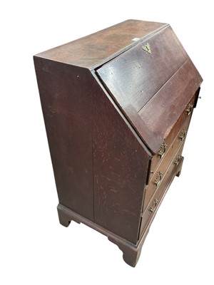Lot 1609 - Georgian III oak bureau of small proportions with fitted interior, three long drawers, on bracket feet, 74cm wide