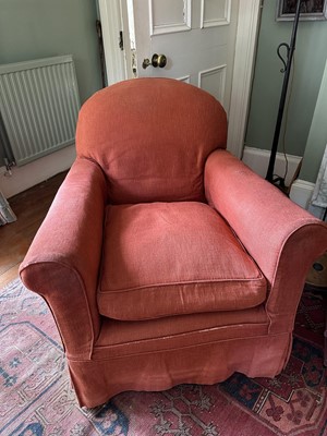 Lot 1610 - Two 1920s country house armchairs upholstered in russet fabric