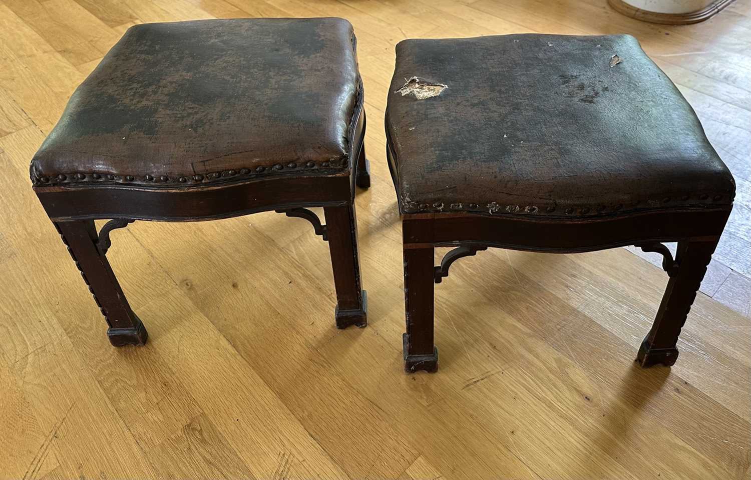 Lot 1611 - Pair of late 19th century mahogany framed footstools with upholstered tops