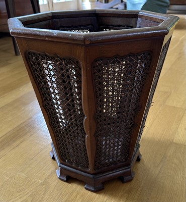 Lot 1612 - 1920s mahogany wastepaper basket of octagonal tapering form with cane work panels, 37cm high