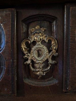 Lot 1558 - Early 18th century French oak serpentine chest of two short and two long drawers, with applied gilt brass mounts depicting figures and foliage