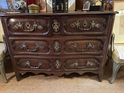 Lot 1558 - Early 18th century French oak serpentine chest of two short and two long drawers, with applied gilt brass mounts depicting figures and foliage
