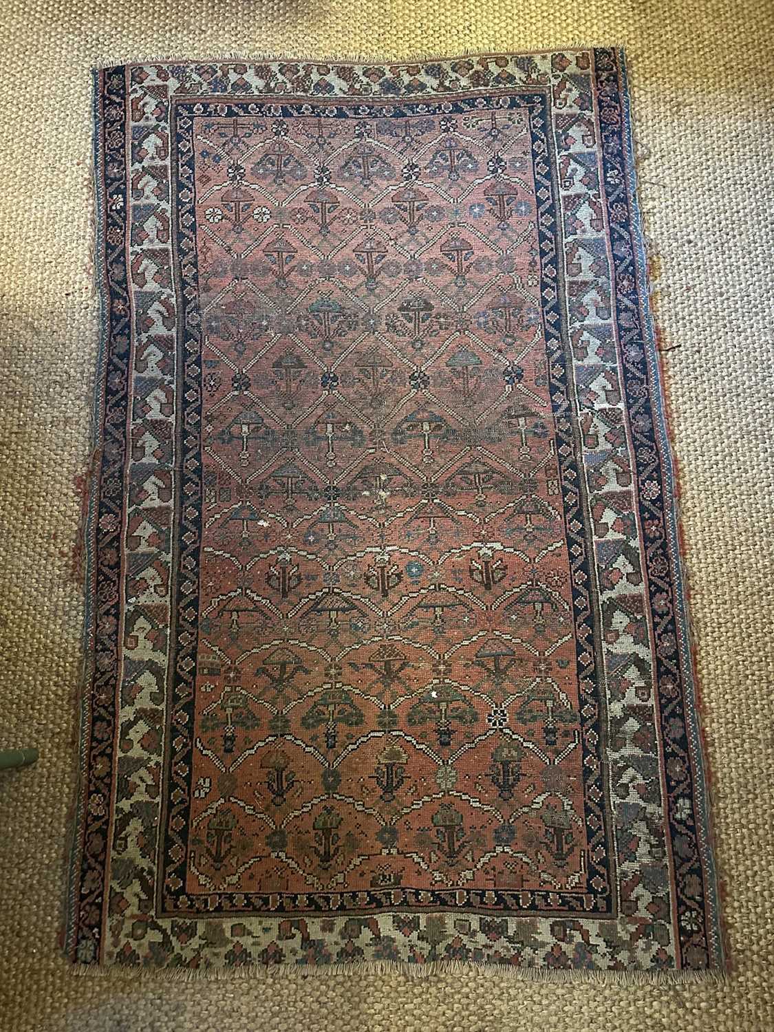 Lot 1568 - Antique Persian design rug on red ground