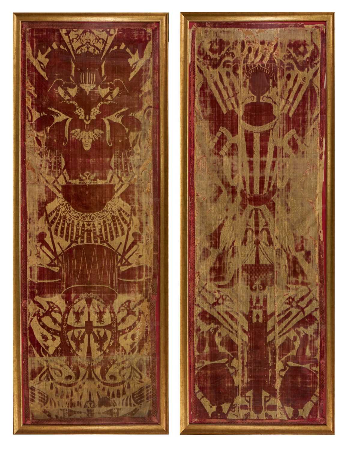 Lot 1573 - Pair of Italian late 17th / early 18th century cut velvet panels depicting trophies of arms, presented in glazed gilt frames