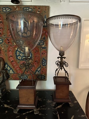 Lot 1597 - Good pair of Regency hurricane lanterns, the glass shades with gilt metal mounts, on scroll gilt brass supports, mahogany plinth bases and brass claw feet