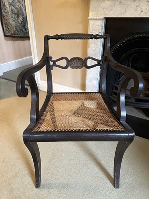 Lot 1680 - 19th century ebonised open elbow chair with caned seat and scroll arms