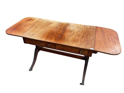 Lot 1681 - Regency mahogany sofa table, twin end drop-flaps above a pair of drawers, on splayed legs joined by a stretcher, 171cm wide overall x 70cm deep
