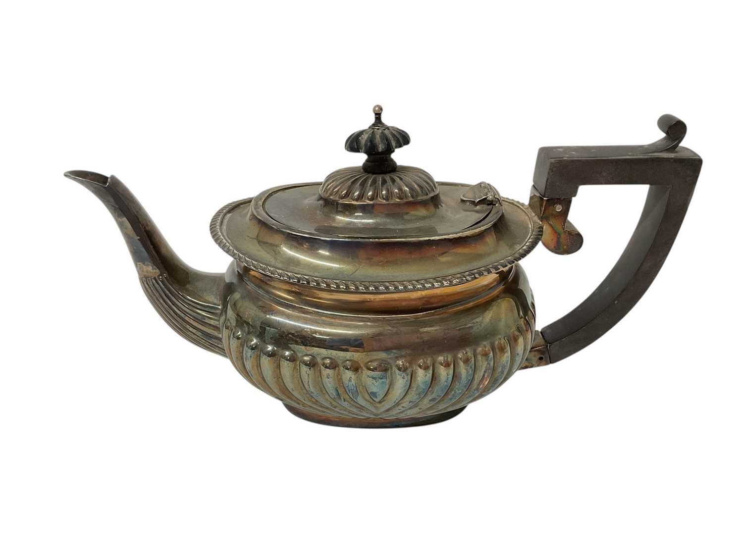 Lot 1602 - Edwardian silver teapot with half fluted body and gadrooned boarder, ebony handle and knop, (Birmingham 1902), all at 11ozs