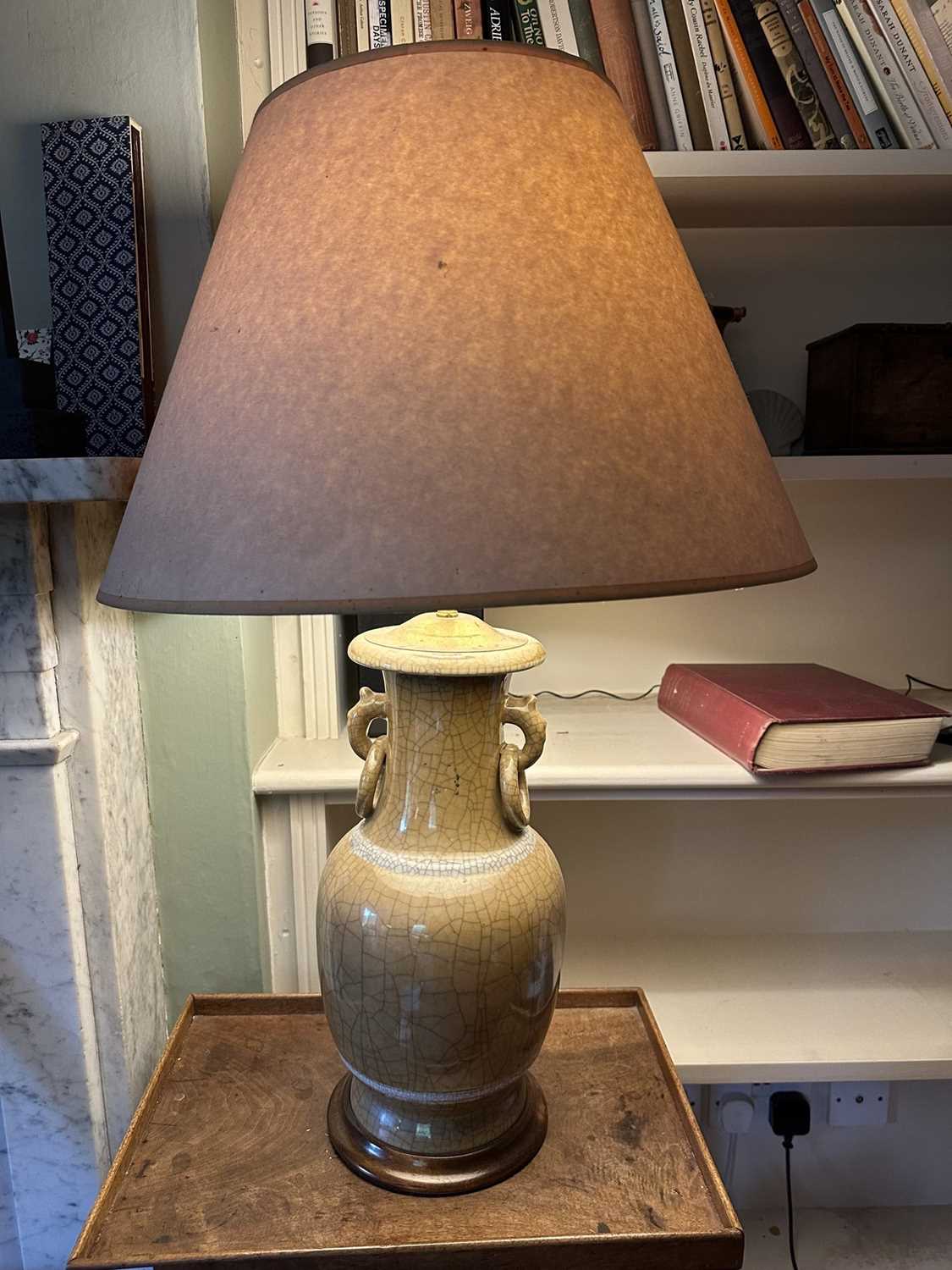 Lot 1633 - Chinese celadon vase as a lamp, all over crackle glaze, on circular wooden base, 41cm high