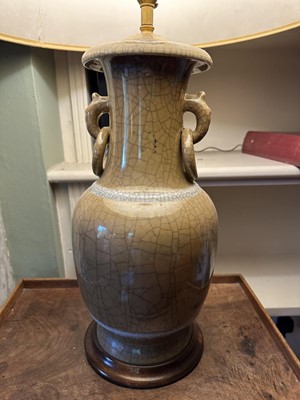 Lot 1633 - Chinese celadon vase as a lamp, all over crackle glaze, on circular wooden base, 41cm high