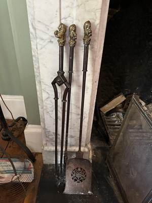 Lot 1635 - Set of three 19th century steel fire tools, each with brass rampant lion knop