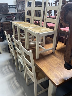 Lot 5293 - Traditional golden oak and cream painted kitchen table and 8 matching chairs with rush seats