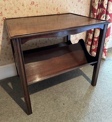 Lot 1743 - Edwardian mahogany table with twin book trough below, on chamfered legs, 69cm wide x 53cm deep x 62cm high