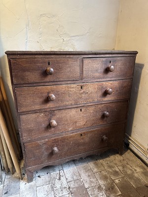 Lot 1745 - George III oak chest of two short and three long drawers, with beaded edge, bun handles and bracket feet