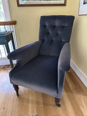 Lot 1779 - Victorian easy chair upholstered in buttoned back corduroy, on turned mahogany legs and castors
