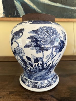 Lot 1783 - 19th century Chinese blue and white vase decorated with a bird on a branch among foliage, four character mark to base, presented under a glass display case