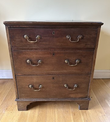 Lot 1803 - Georgian mahogany chest of three long drawers with brass handles, on bracket feet