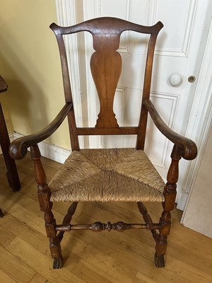 Lot 1811 - 18th century fruitwood splat back open elbow chair with rush seat, on turned legs, Spanish feet and turned stretchers
