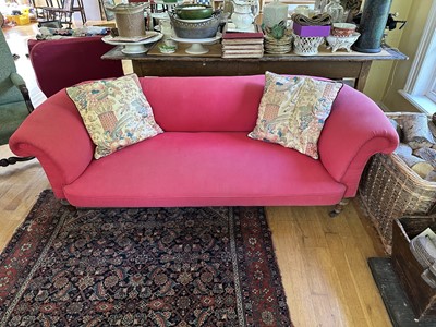 Lot 1815 - Victorian double scroll end sofa upholstered in pink fabric, on turned legs and castors