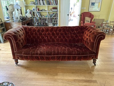 Lot 1816 - Large Victorian chesterfield with buttoned brown velvet upholstery, on turned legs and castors