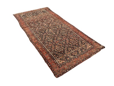 Lot 1818 - Antique Persian design rug on blue ground