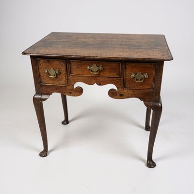 Lot 1381 - George III oak lowboy