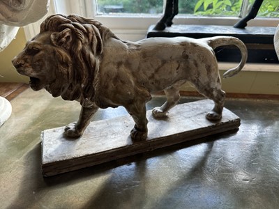 Lot 1832 - Antique plaster model of a lion, on rectangular base, 44cm long x 23cm high