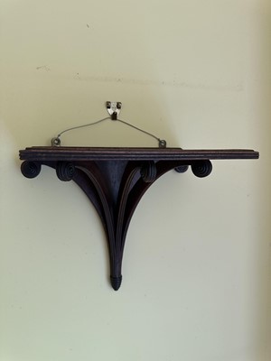 Lot 1835 - 19th century mahogany wall bracket with reeded scroll supports and turned roundels, 25cm high
