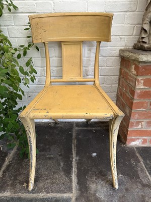 Lot 1869 - 19th century yellow painted metal chair in the Regency style, on sabre legs terminating on brass castors