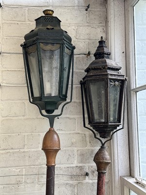 Lot 1870 - Two Antique gondola lanterns on pivoting brackets and wooden poles, 225cm and 215cm high overall