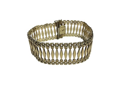 Lot 103 - 9ct gold bracelet with a wide band of articulated fancy links