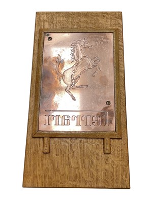 Lot Ferrari interest- polished copper printing plate, used to produce the embossed cover of the official 1988 Ferrari UK calendar, mounted in an oak frame, the printing plate 25.5 x 17.5cm, 45 x 23c...