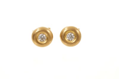 Lot 669 - Pair of 18ct gold and diamond single stone stud earrings