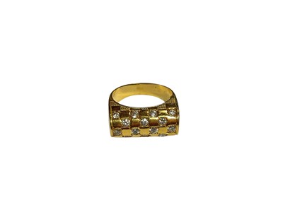 Lot 2 - Gold dress ring with chequered design of synthetic white stones
