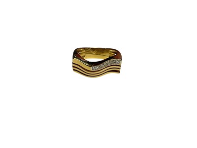 Lot 3 - 18ct gold diamond set ring with a four band wavy design