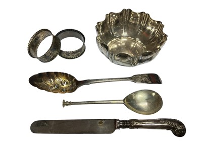 Lot 109 - Victorian silver bowl with crimped edges, Victorian silver berry spoon, pair of Edwardian silver napkin rings, seal end spoon and a silver handled butter knife (6 items)