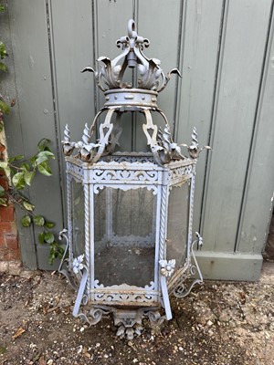 Lot 1925 - Antique wrought iron and painted garden lantern of hexagonal form with elaborate acanthus leaf ornament and glazed sides, 120cm high. Provenance: believed to have been removed from a Roth...