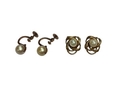 Lot 94 - Two pairs of cultured pearl earrings, one in 9ct gold clip on setting and the other in yellow metal screw back setting