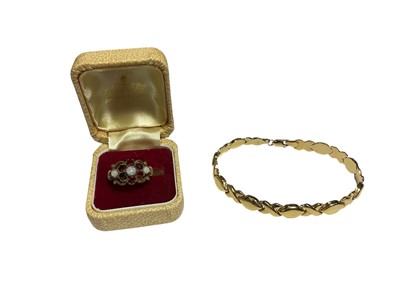 Lot 111 - 9ct gold ‘xo’ articulated link bracelet and a 9ct gold garnet and opal flower head cluster ring