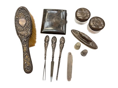 Lot 1015 - Silver cigarette case, silver mounted brush, two silver topped glass jars, other silver mounted vanity items etc