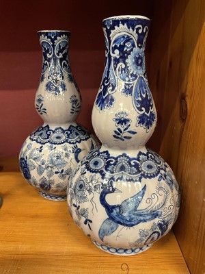 Lot 198 - Pair of 19th century Dutch tin glazed pottery blue and white gourd shape vases