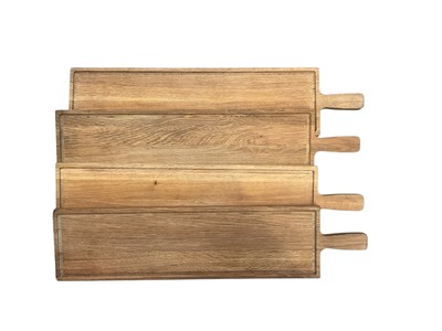 Lot 250 - Four light oak bread boards/cheese boards