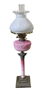 Lot 5004 - Victorian Corinthian column oil lamp with pink glass reservoir.
