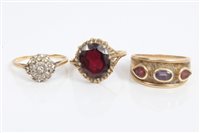 Lot 3392 - Three gold (9ct) and gem set dress rings - to...