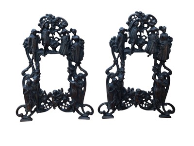 Lot 5030 - Pair of figural cast metal photo frames with registration marks to backs, to hold photos 13.5cm x 9.5cm