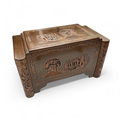 Lot 5301 - Chinese camphor wood chest carved with figures and temples