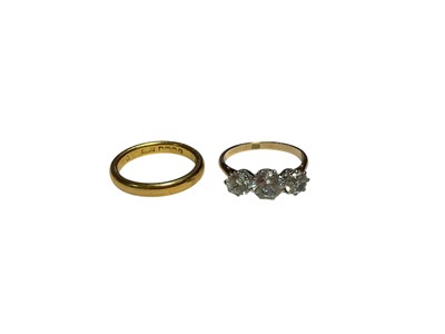 Lot 95 - 22ct gold wedding ring and a 9ct gold synthetic white three stone ring (2)