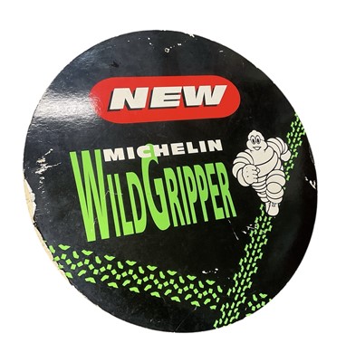 Lot 112 - Michelin Tyres cardboard double sided advertising sign "New Michelin Wild Gripper", 62.5cm in diameter.