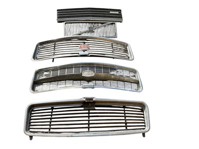 Lot 127 - Group of five classic car radiator grills to include Austin, Mazda and Volvo, together with seven Austin wheel trims (12)