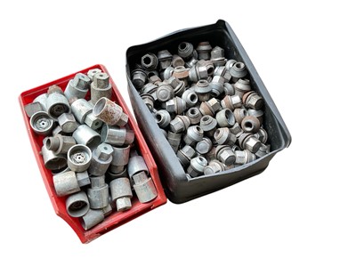 Lot 139 - Two boxes of various car wheel nuts, locking wheel nut keys and a Vauxhall spare wheel kit, (3).